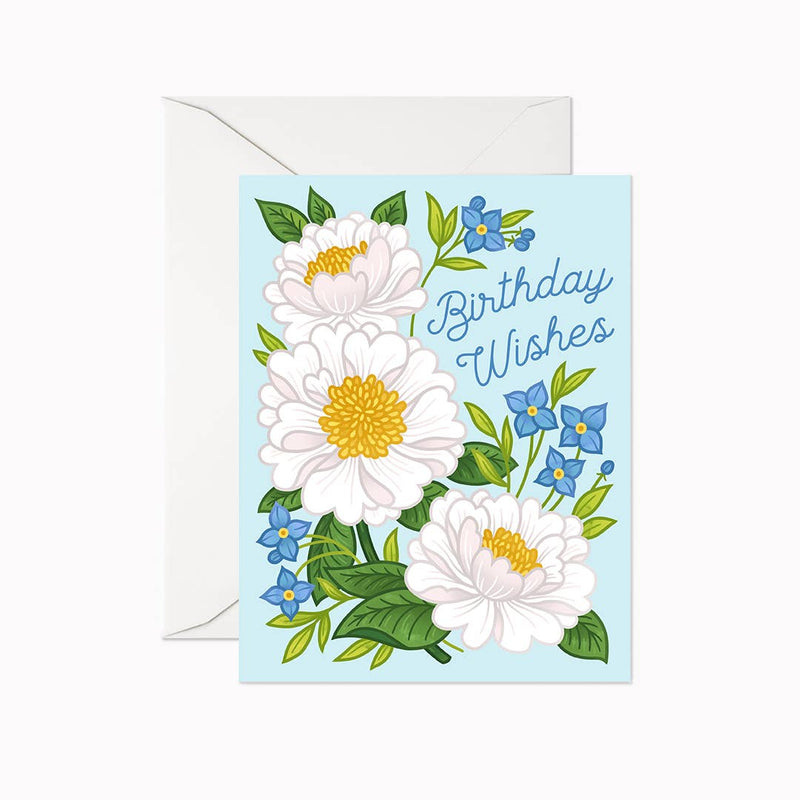 A greeting card with a floral design and the text 'Birthday Wishes' across the top. The card is accompanied by a white envelope.