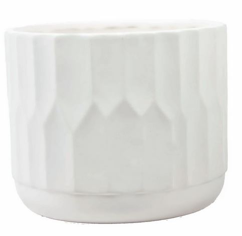 White ceramic pot with textured surface on a white background