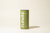 Green canister with 'FLOWRS' branding on a beige background
