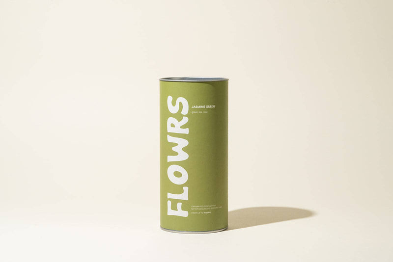 Green canister with 'FLOWRS' branding on a beige background