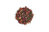 Dry tea leaves with floral petals on a white background