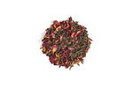 Dry tea leaves with floral petals on a white background