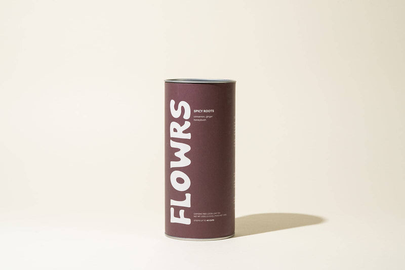 Cylindrical container with 'FLOWRS' branding on a beige background