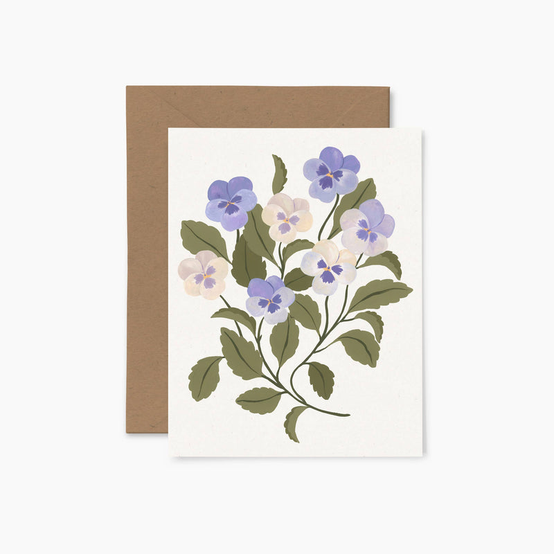 A greeting card with a floral illustration of pansies and a brown envelope.