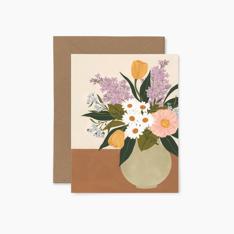 A greeting card featuring an illustration of a bouquet of various flowers in a vase, with a beige background and a brown envelope.